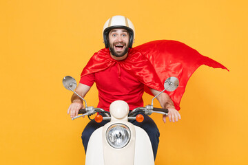 Delivery superhero man in helmet red cloak t-shirt uniform driving moped motorbike scooter isolated...