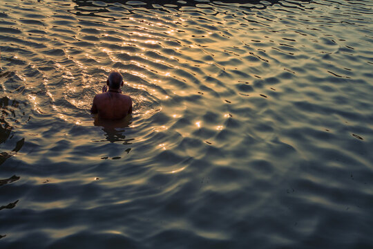 Pilgrims bathing at River Ganga, Varanasi.