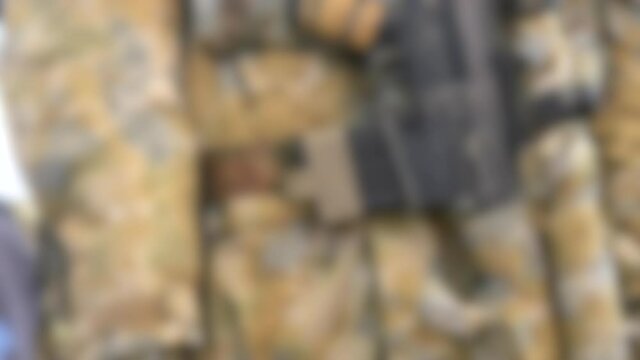 Blurred background. Mannequin dressed various body armor