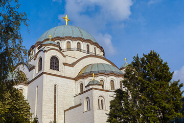 Fototapeta na wymiar Beautiful Saint Sava christian catedral with blue cloudy sky in the capital Belgrade