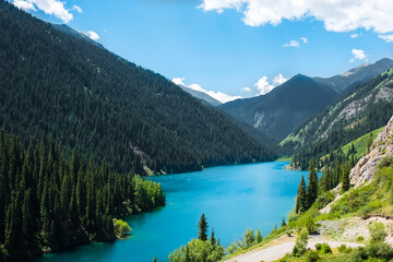 Naklejka na ściany i meble Beautiful view to Kolsai or Saty lake with mountains background. Summer vacation concept. Scenic travel background. Travel in Kazakhstan concept.