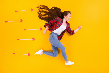 Fototapeta na wymiar Top view above high angle flat lay flatlay lie concept of cheerful girl running fast hurry rush arrows flying catch partner match making isolated on bright vivid shine vibrant yellow color background