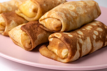 Wheat flour pancakes with strawberries. Sweet homemade pastries for breakfast. With sugar.