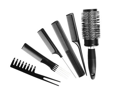 Set of modern hair combs and brush isolated on white, top view
