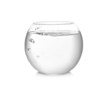 Round fish bowl filled with water on white background