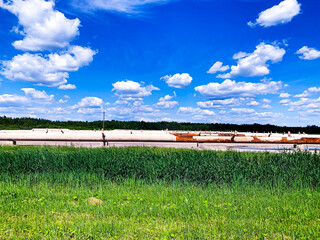 Shutdown Cooling of the Atomic Station, Heat of a power plant against a background of white clouds...
