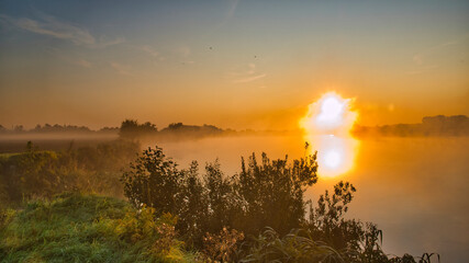 fog at the cliff above the river, early morning, summer dawn