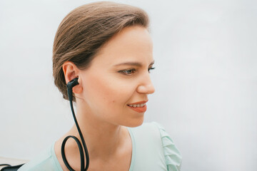 Beautiful adult woman having a hearing test with special medical equipment. Impedance audiometry, tympanometry in a hearing center