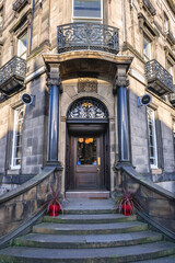 Fototapeta na wymiar Entry to Cafe Noir bar in Edinburgh city, Scotland, UK