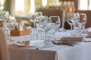 Empty glasses in restaurant background. Table set for an event party or wedding reception.