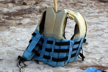 Old life vest on a beach