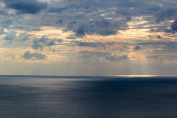 Cloudy sky over the sea horizon