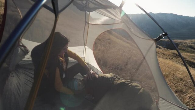 People inside the tent. on a mountainside in Montenegro mooving camera