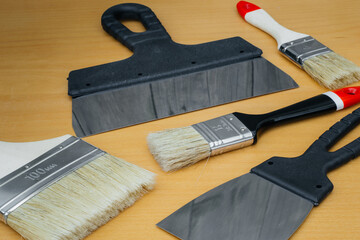 Tool for painting work. Spatula and brushes. Set of items for repair. Top view of a builder with a...