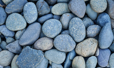 Grey pebbles stone background with vintage filter 