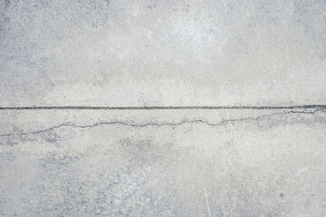 Crack raw cement wall or concrete floor background