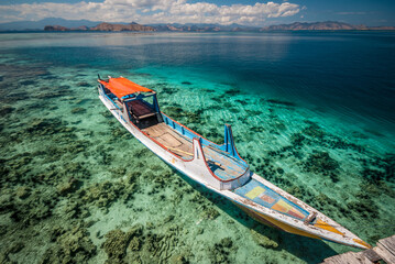 Boat at the deck in the island of Kanawa, Flores