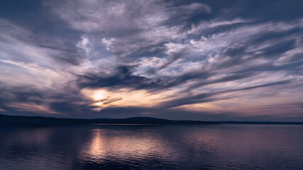Fototapeta na wymiar beautiful clouds during sunset over the lake