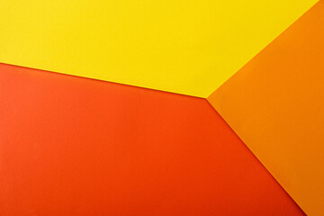 abstract geometric background with red, yellow and orange bright paper