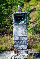 A traditional stone-made candle-holder, faldstool, iconostasis at Vradeto village, Zagoria area,...