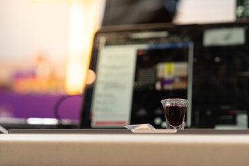 A Christian man is involved in holy communion by the online church at his house: Sunday service online.