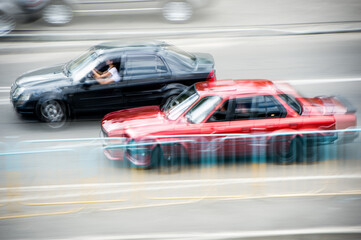 Plakat Cars at speed. Street racing. Cars in motion. Blurry cars at speed. Speed.