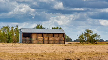 Fototapeta na wymiar Hay bale shed in the Australian countryside Perth