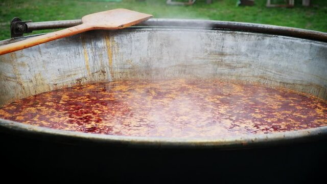 Bograch. Soup with paprika, meat, bean, vegetable, dumpling. Traditional Hungarian Goulash in cauldron. Meal cooked outdoors on an open fire. HD