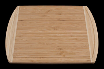 Wooden cutting board on a black background