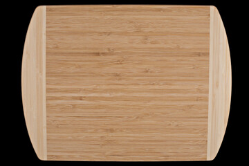 Wooden cutting board on a black background