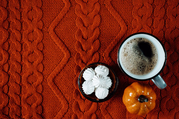 Coffee with marshmallows, autumn background