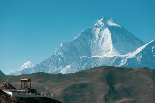 Small building near muktinath temple at mustang, Nepal. Blue sky sunny day and everest mountain on the background.
