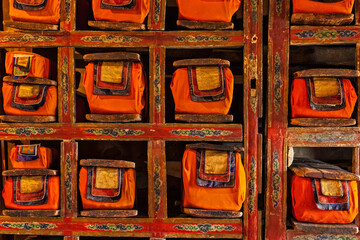 Folios of old manuscripts in library of Thiksey Gompa (Tibetan Buddhist Monastery). Ladakh, India
