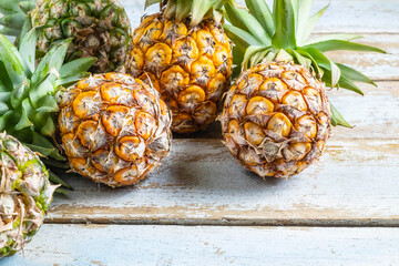 .Fresh pineapple fruit on a wooden table