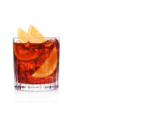 Negroni Cocktail in crystal glass with ice cubes and orange slices on white background with...