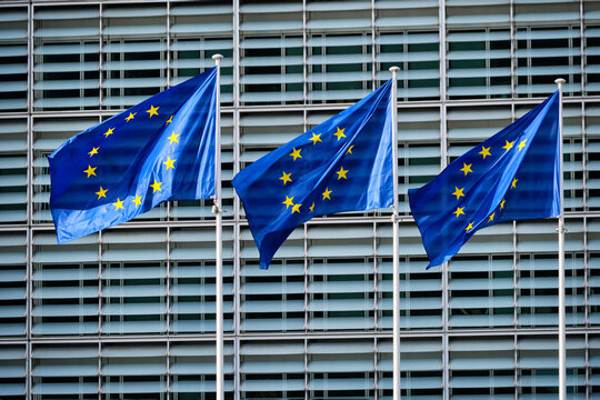 European EU Flags In Front Of The Berlaymont Building, Headquarters Of The European Commission In Brussels