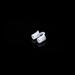 Anti Snoring device on a black background. Isolated. Stop snoring product.