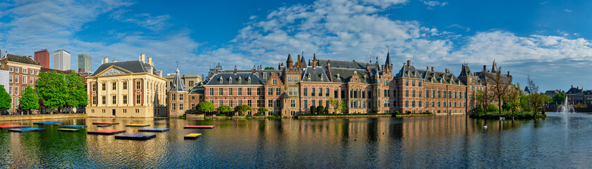 Fototapeta na wymiar Panorama of the Binnenhof House of Parliament and Mauritshuis museum and the Hofvijver lake. The Hague, Netherlands