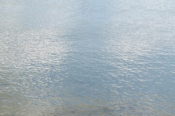 Light blue river water surface, natural water background