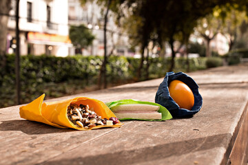 Reusable Beeswax Food Wraps. Organic fabric covers for food storage. Lifestyle photos on the beach, park, kitchen with food