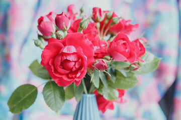 Bouquet of red roses in a blue vase