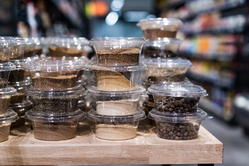 various spices and herbs packed in small transparent plastic boxes