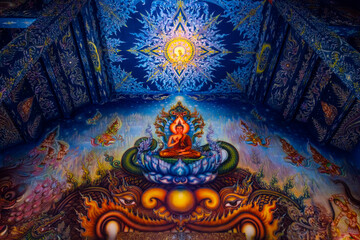 Wat Rong Suea Ten or The Blue Temple translates as House of the dancing tiger. A monumental, modern Buddhist temple distinguished by its vivid blue coloring & elaborate carvings in Chiang Rai Province