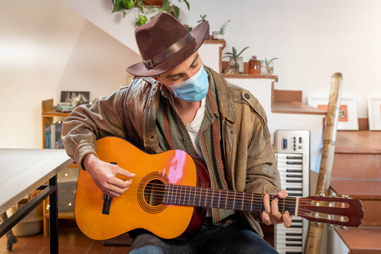 Talented Country Guitarist. Handsome Young Man Playing Guitar With Face Mask. Country Clothing. Musician Playing Live Concert. Coronavirus.