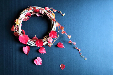 Autumn background with vibrant fall leaves on black, a design template with a place for text