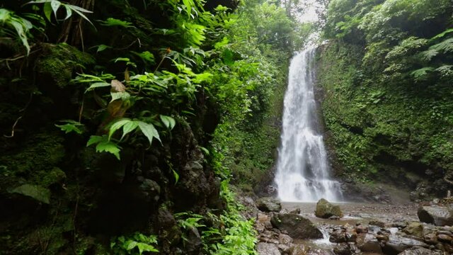 Slow motion on the famous Melanting waterfall in the Munduk forest, Bali island, Indonesia