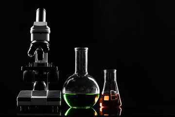 laboratory microscope on table in the dark