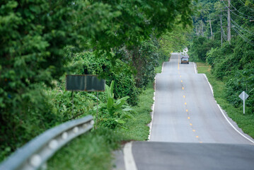 Beautiful roads in the midst of nature, roads with green trees along the way. Roads in Thailand