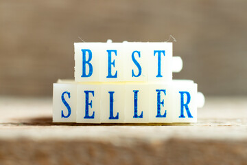 Letter block with blue color word best seller on wood background
