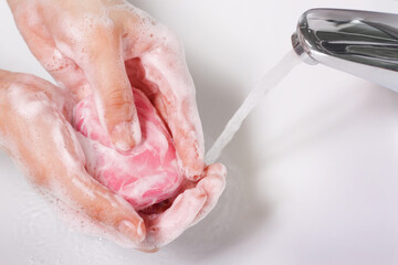 Washing of female hands with soap and water. The concept of disinfection, healthy lifestyle, hygiene, health and beauty.